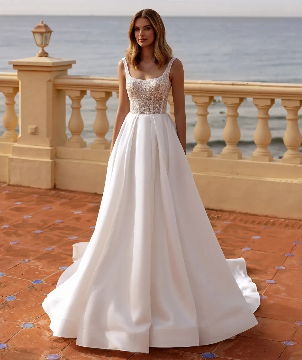 Model wearing a white Oliver Martino gown