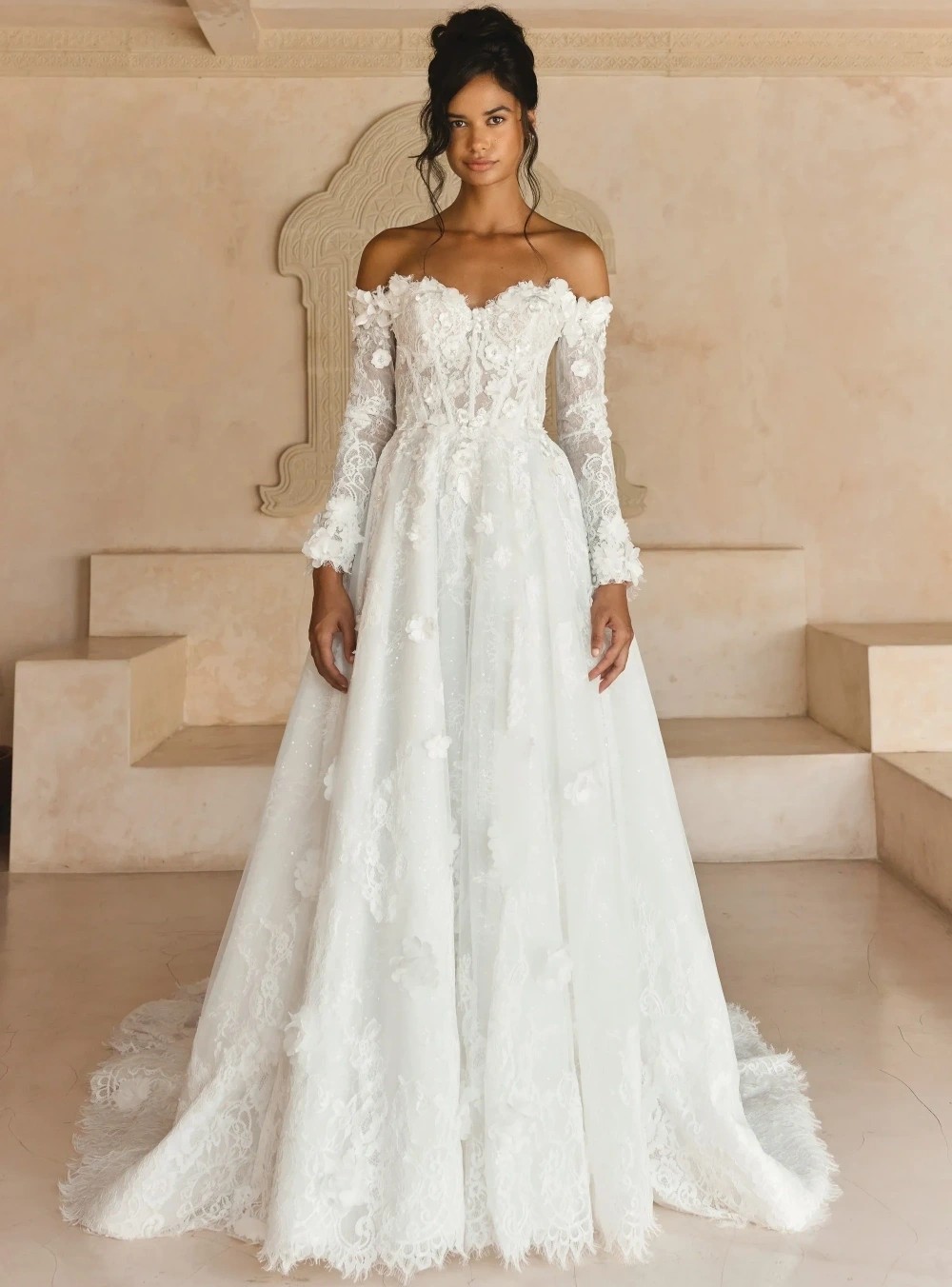 Model wearing a white Madi Lane gown