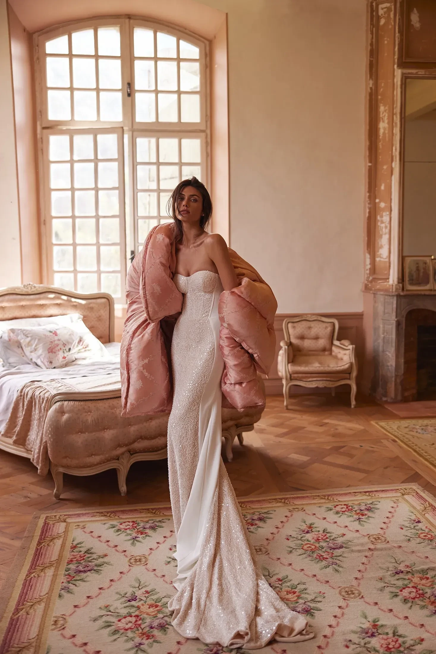 Model wearing a white Oliver Martino gown