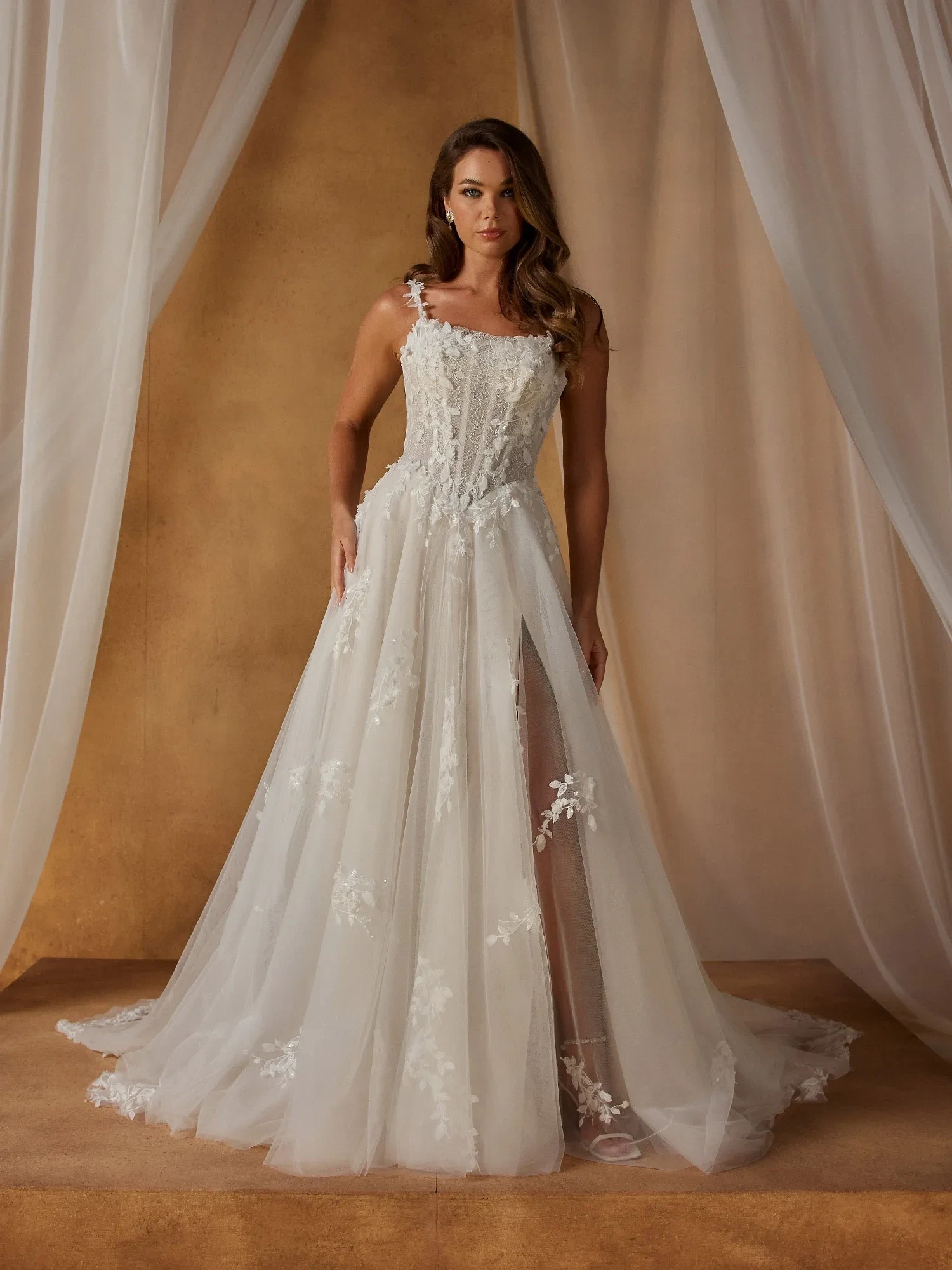 Model wearing a white Madi Lane gown